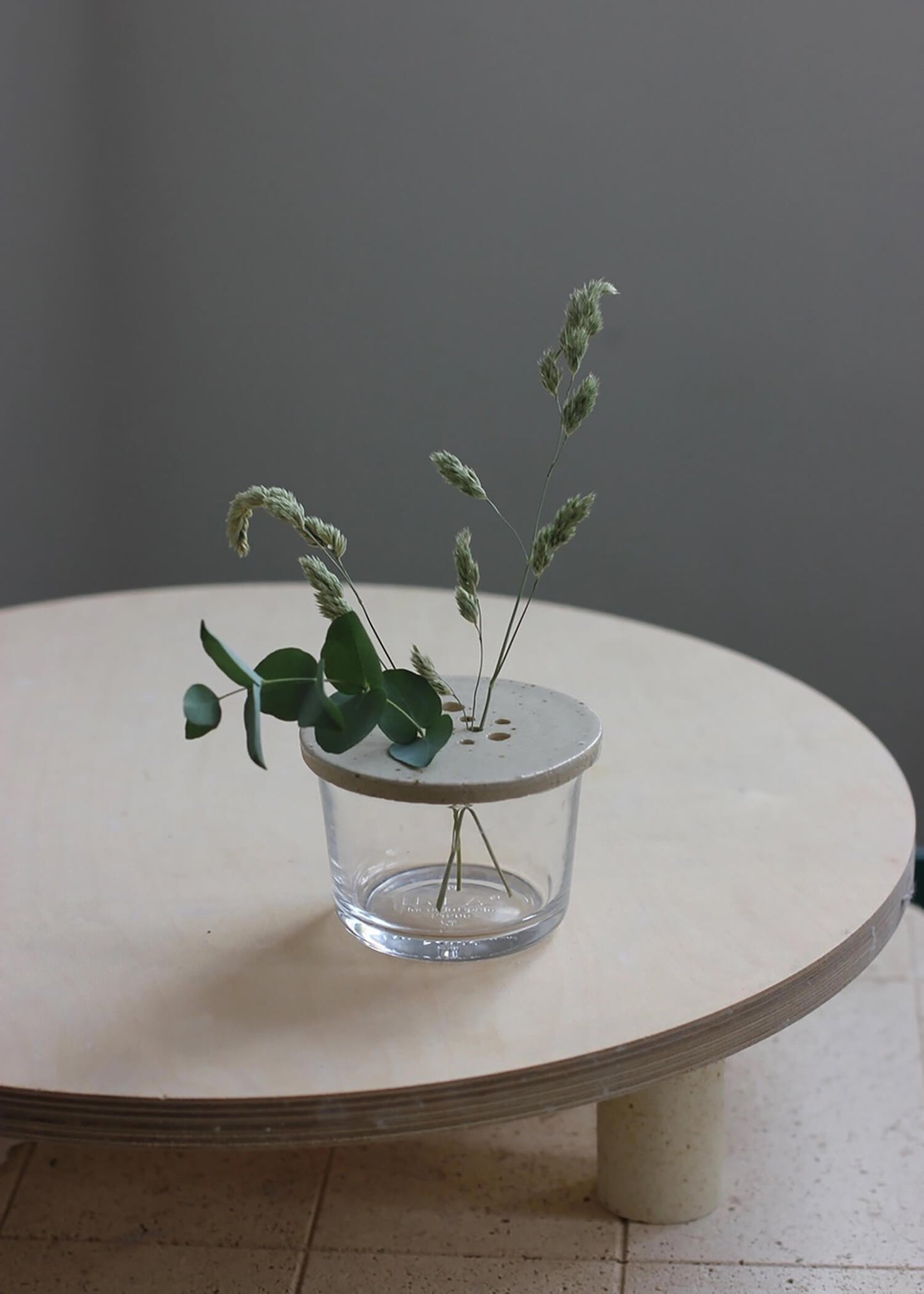 Stylish ceramic flower stem holder for a jar