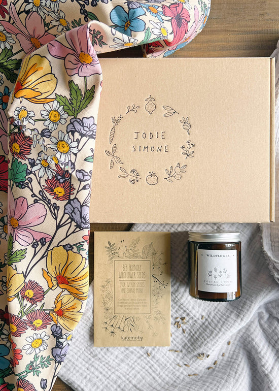 Wildflower gift box including wildflower tea towel, wildflower candle and wildflower seeds.