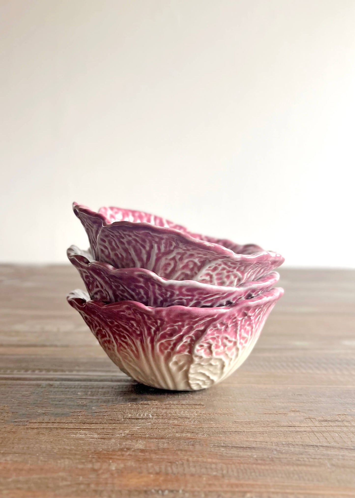 Three ceramic stacked cabbage bowls