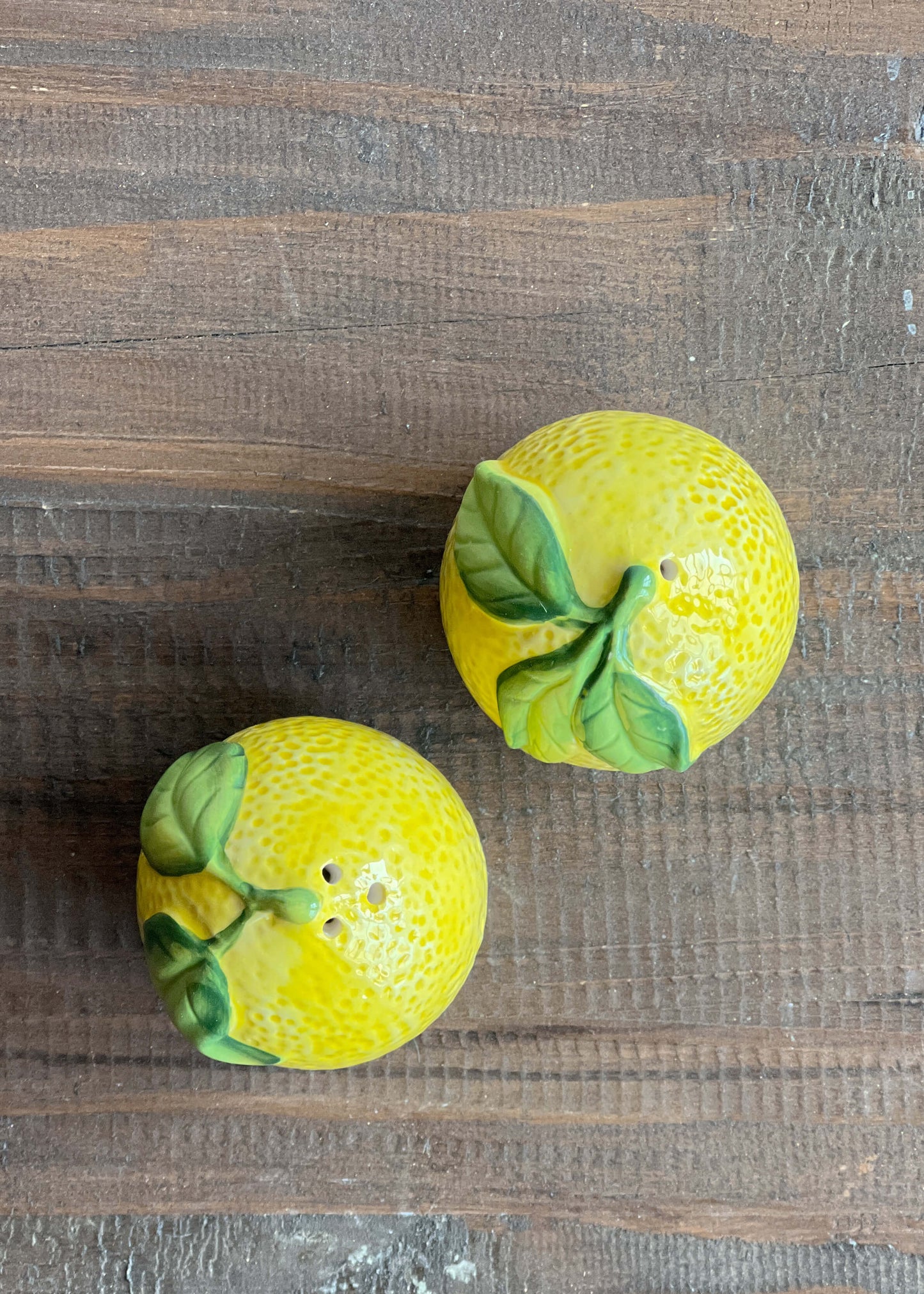 Salt and pepper shakers in the style of lemons