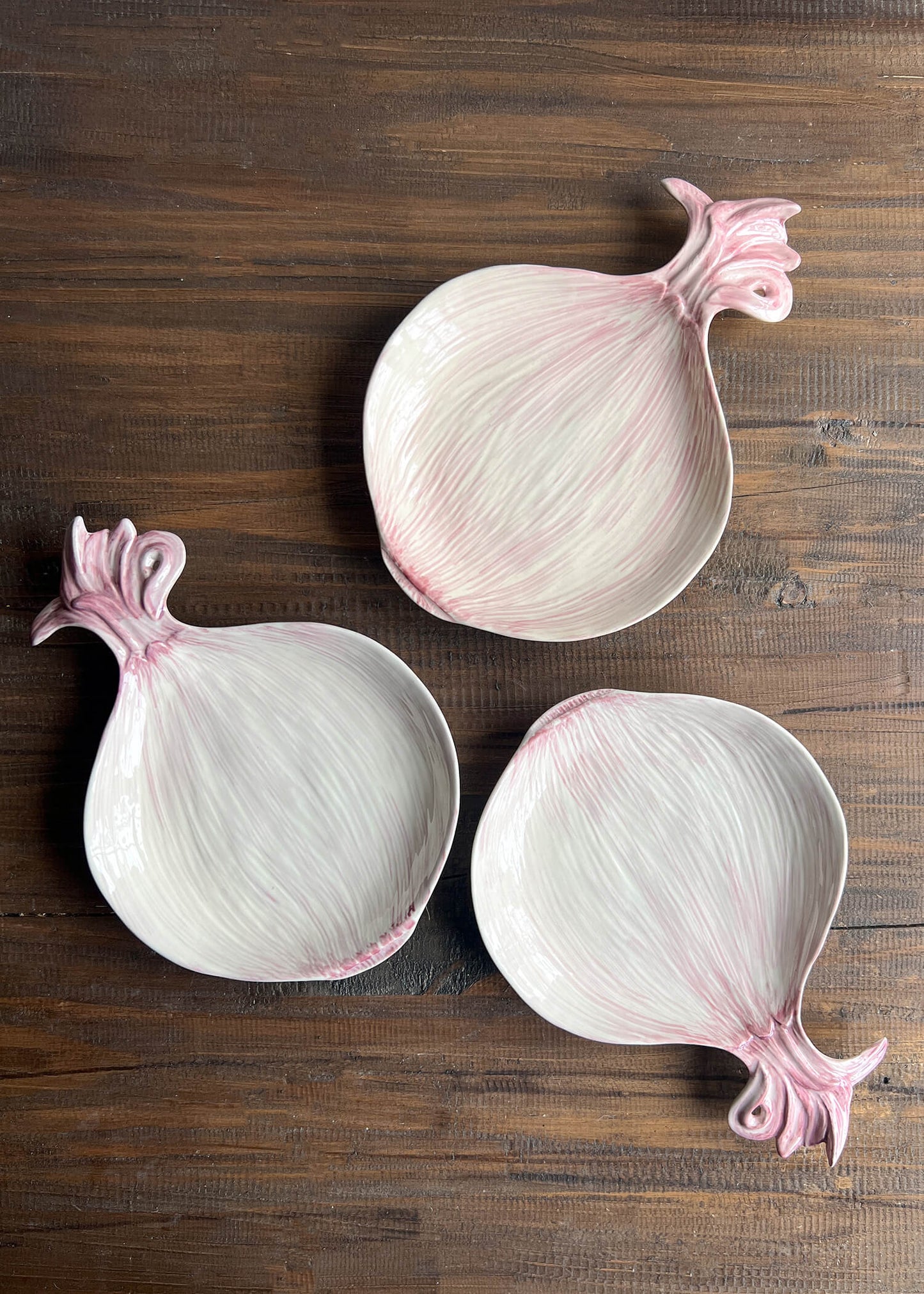 Three ceramic red onions 