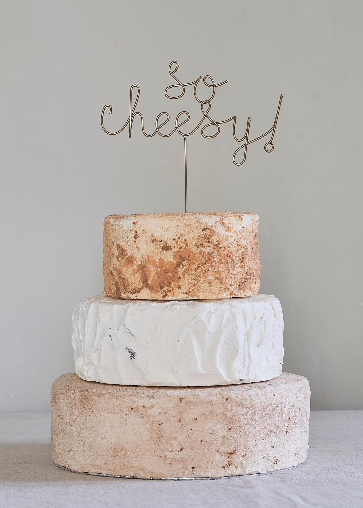 so cheesy wedding cake topper for a cheese stack cake